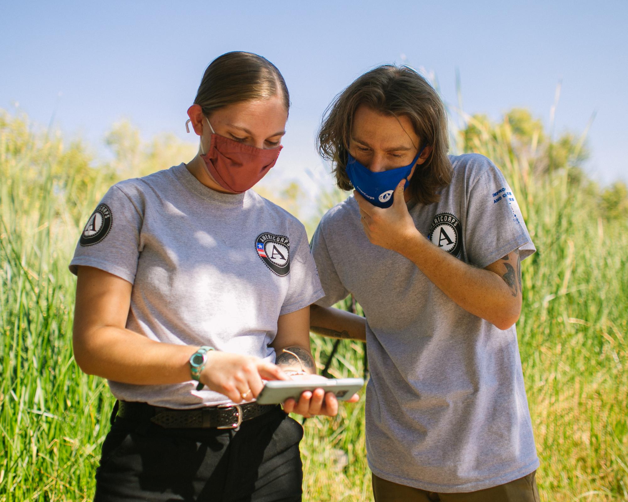 Photo of Water Educators looking at notes at Sweetwater Wetlands