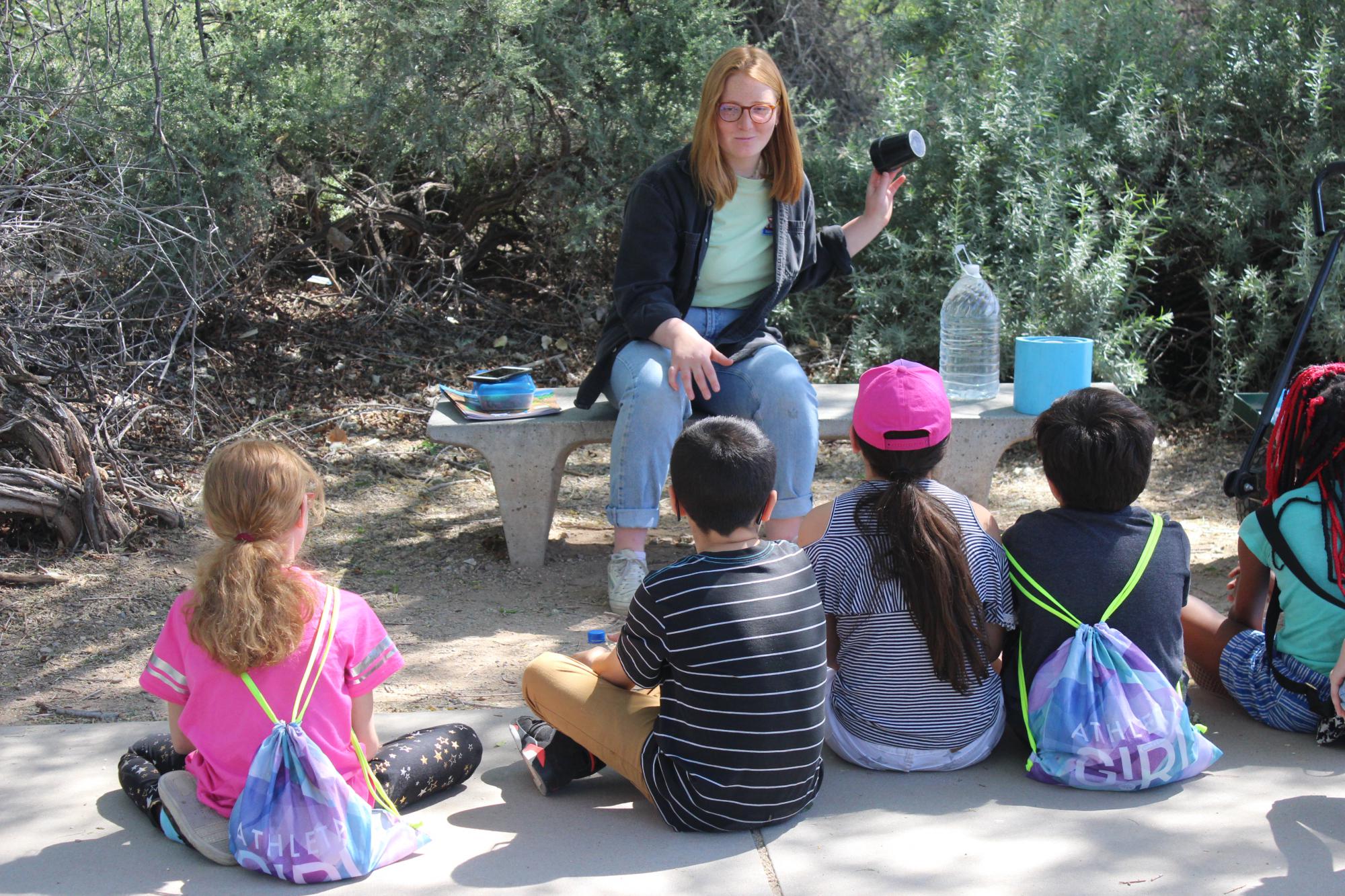 Photo of Students Observing Technology at Water Conservation Technology Station at Sweetwater Wetlands
