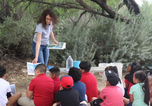 Photo of Water Educator teaching students at Sweetwater Wetlands